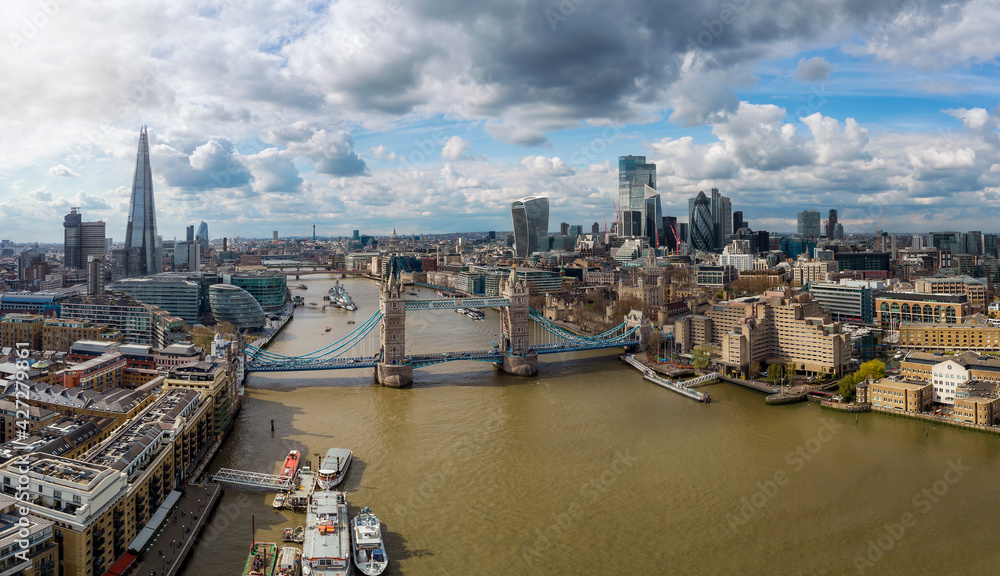 Panoramic view of the London skyline with Tower Bridge and City district on a sunny day