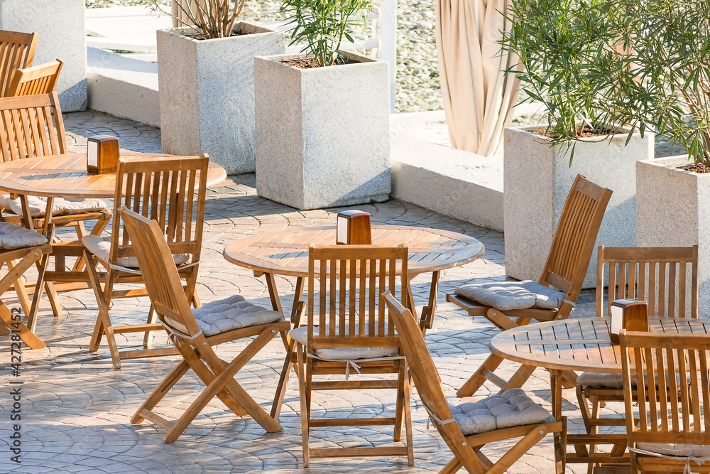 Fototapeta premium An empty outdoor cafe with no people during the covid-19 pandemic. ..