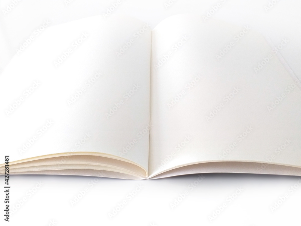 Open, empty and blank notepad isolated on white background. Aerial view of notebook to write made with sustainable paper. Stationery and writing concept. Open, empty and blank notepad isolated on white background. Aerial view of notebook to write made with sustainable paper. Stationery and writing concept.