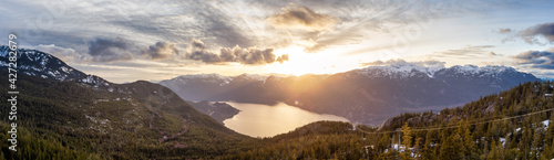 Panoramic View of Canadian Nature Mountain Landscape from Sea to Sky Gondola Summit Viewpoint. Colorful Sunny Spring Sunset. Taken near Squamish, North of Vancouver, BC, Canada.