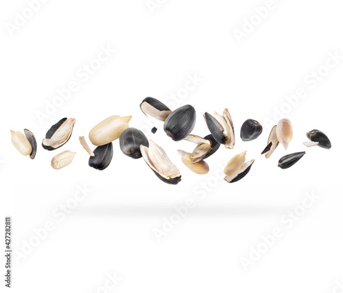 Peeled sunflower seeds close-up hovered in white space