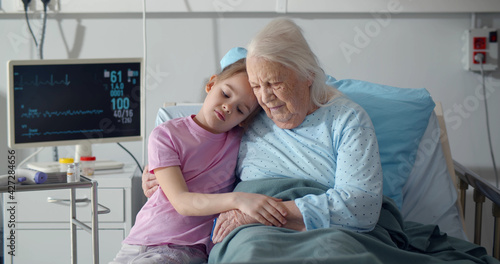 Photos Upset little girl visiting her grandmother at hospital ward