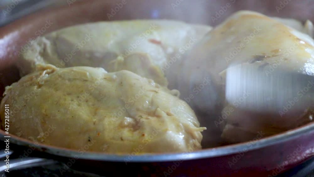 Close up shot of large chicken breasts being grilled and flavored o perfection. Searing, prepping to finish off in the oven. Close up shot of large chicken breasts being grilled and flavored o perfection. Searing, prepping to finish off in the oven.