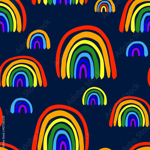 Beautiful bright colorful different rainbows isolated on dark blue background. Childish cute seamless pattern. Vector simple flat graphic hand drawn illustration. Texture.