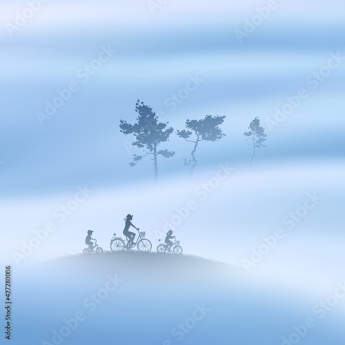 Family on bikes. Mother and children. Cyclist silhouette. Tree in fog