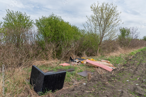 Принти на полотні Discarded furniture in nature. Garbage Dumped in Beautiful Nature