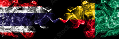 Thailand, Thai vs Benin, Beninese smoky mystic flags placed side by side. Thick colored silky abstract smokes flags.