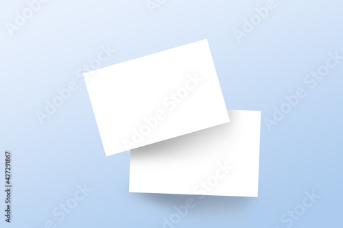 Realistic mockup branding business cards template with shadow on light blue background. Flat lay, top view.