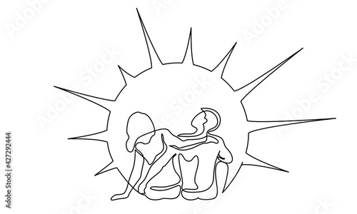 Loving happy couple woman and man sitting and watching sunshine or sunrise.