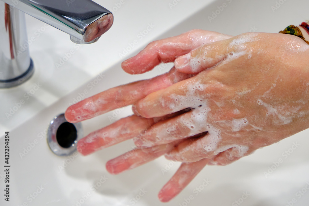 Wash hands by rubbing with soap for prevention of corona virus, hygiene to stop spreading coronavirus.