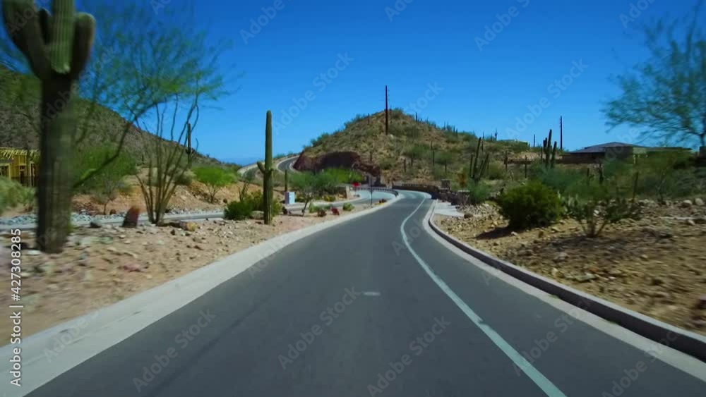Driving Over A Bridge Up A Curve Hill With Wall And Saguaro Cactus In Scottsdale Fountain Hills Arizona Driving Over A Bridge Up A Curve Hill With Wall And Saguaro Cactus In Scottsdale Fountain Hills Arizona
