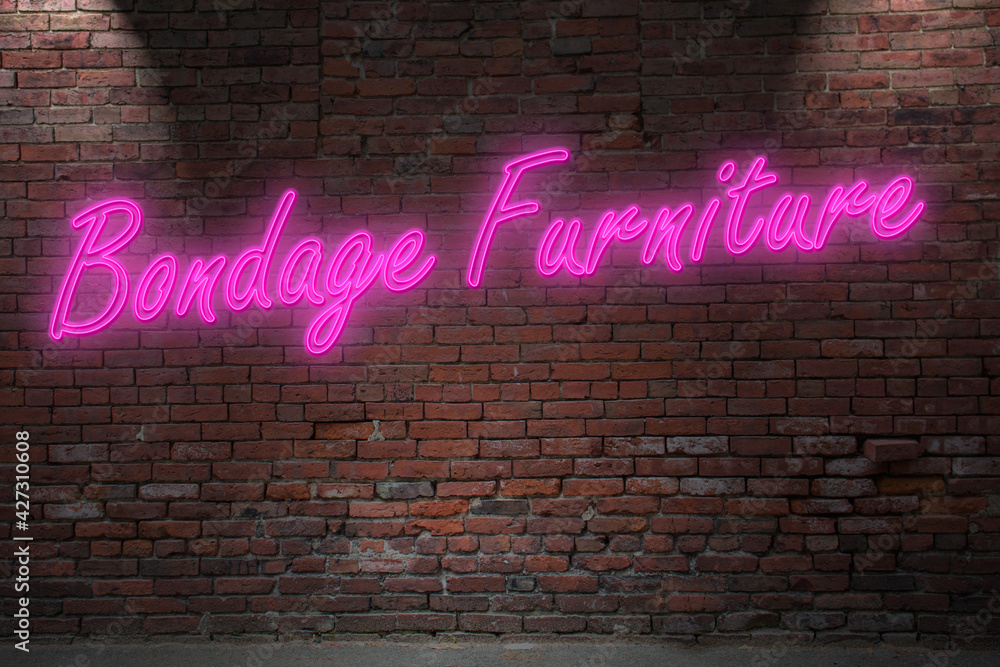 Obraz premium Neon Bondage Furniture lettering on Brick Wall at night