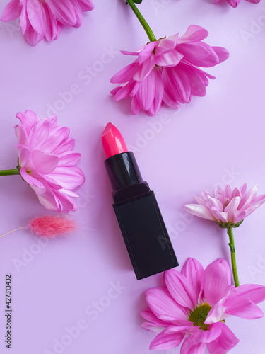 lipstick flower on colored background