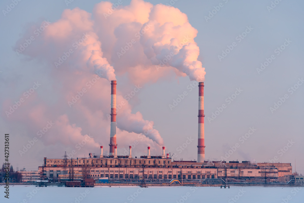 Industrial factory pipes emission carbon gases in atmosphere. Industry zone emission, Factory with thick smoke plumes. Climate change, ecology and global warming