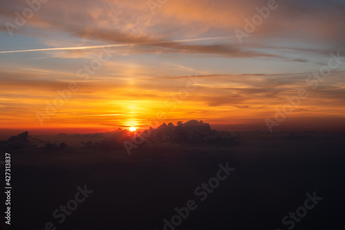 Sunrise and dramatic clouds at 20 000 feet 