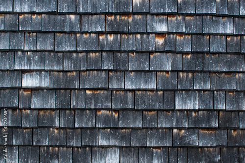 old wooden wall, old wooden roof, old dark weathered wood shingles