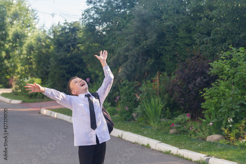 The student is happy about the end of the school day and the holidays after school and laughs