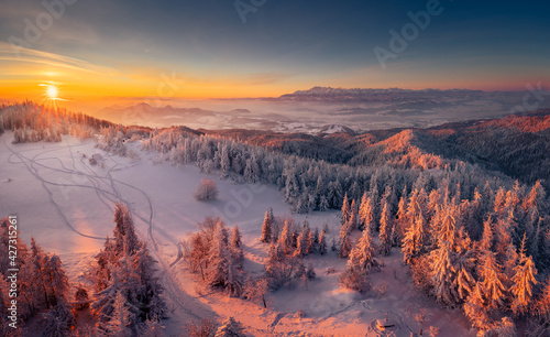 Winter morning in Gorce on the tower on the top of Lubań. A beautiful, romantic atmosphere with a view of the Pieniny Mountains, the Beskids and the Tatra Mountains. 