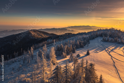 Winter morning in Gorce on the tower on the top of Lubań. A beautiful, romantic atmosphere with a view of the Pieniny Mountains, the Beskids and the Tatra Mountains.  © PawelUchorczak
