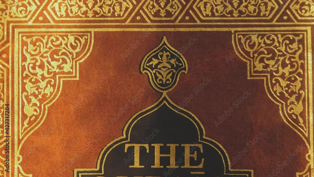 Shot of the front cover of a noble Quran-the shot is moving from the top down Shot of the front cover of a noble Quran-the shot is moving from the top down