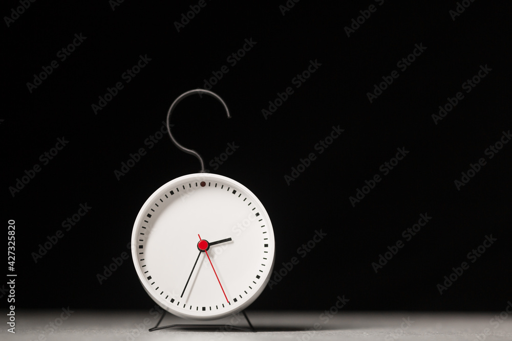 Alarm clock on a dark background. Alarm clock on a dark background.