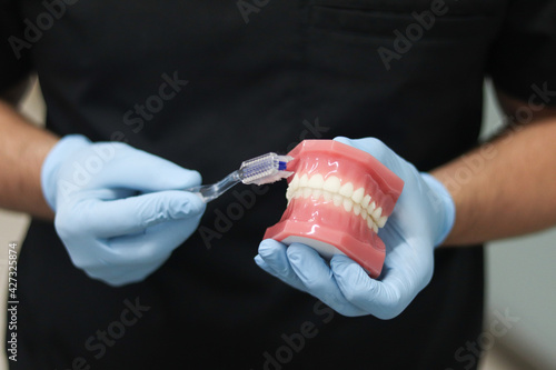 dentist holding dental tools