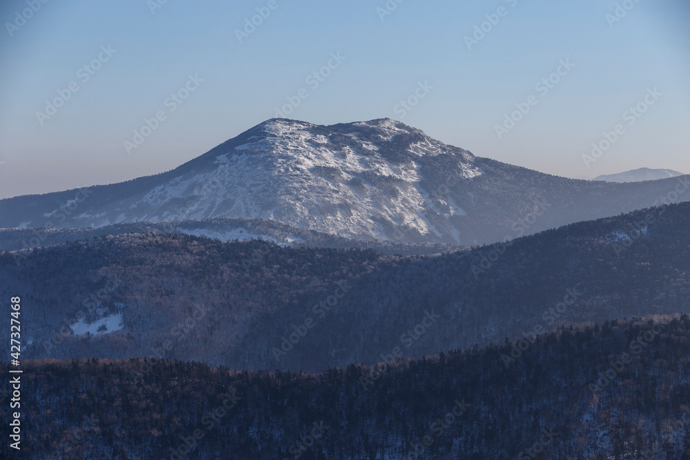 Travel across the Primorsky Territory. Snow-covered Peak of Pidan Mountain