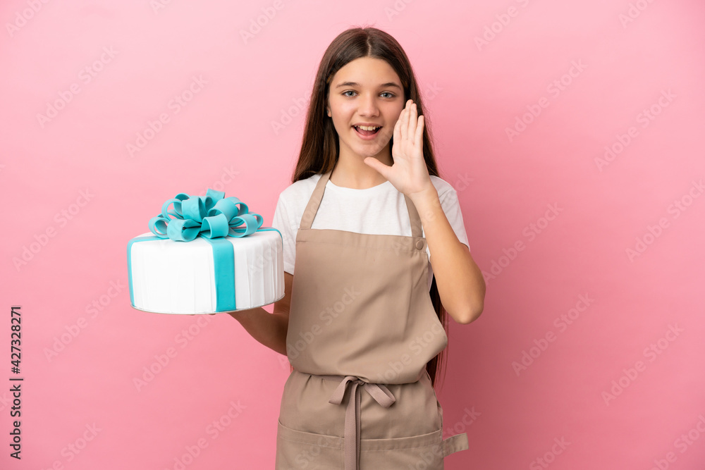 Little girl with a big cake over isolated pink background shouting with mouth wide open Little girl with a big cake over isolated pink background shouting with mouth wide open