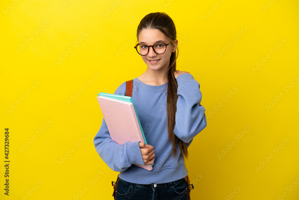 Student kid woman over isolated yellow background laughing Student kid woman over isolated yellow background laughing