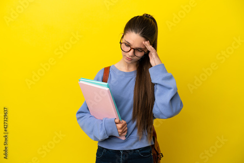 Student kid woman over isolated yellow background with headache