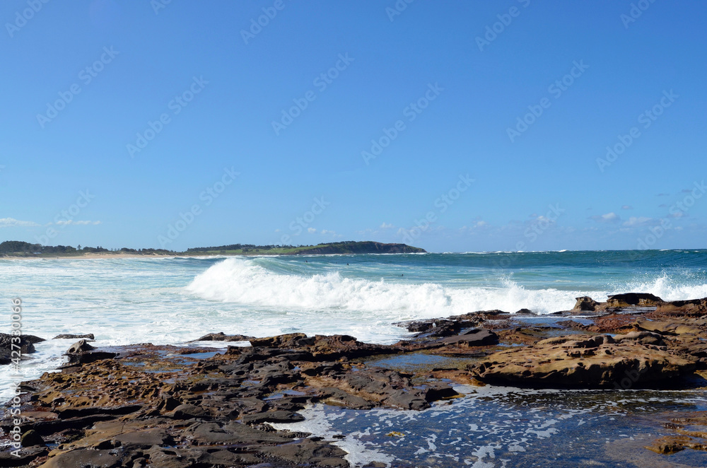 waves crashing on rocks