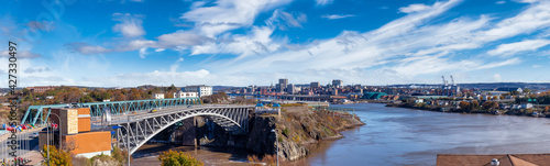 Saint John, New Brunswick, Canada. Panoramic View of Reversing Falls Bridge during a sunny day. Blue Sky Art Render. © edb3_16