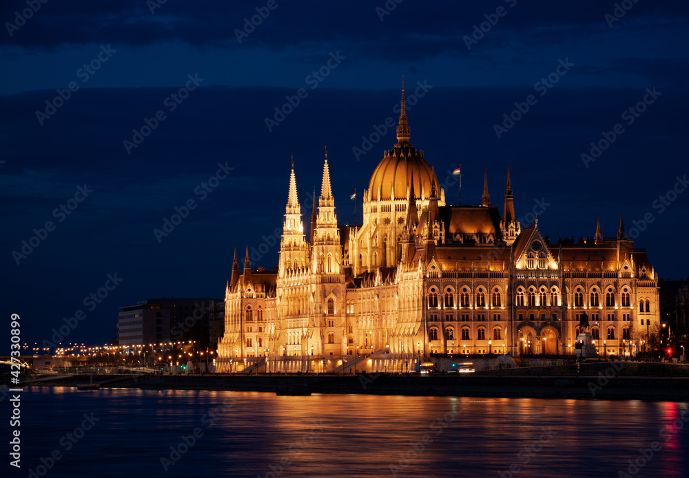 Hungary, Budapest city at night, parliament by the river, reflection of lights in the water