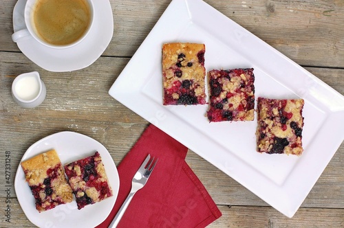 Wholegrain cake with forrest fruit on white plate