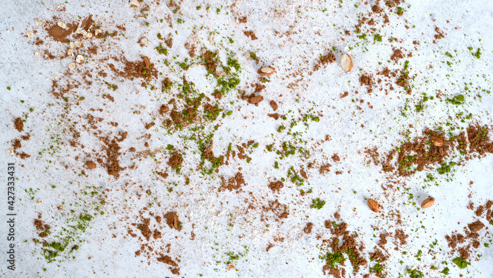 Fototapeta premium Background covered by matcha tea powder, coconut powder and cocoa powder. Healthy eating. Selective focus. Top view. 