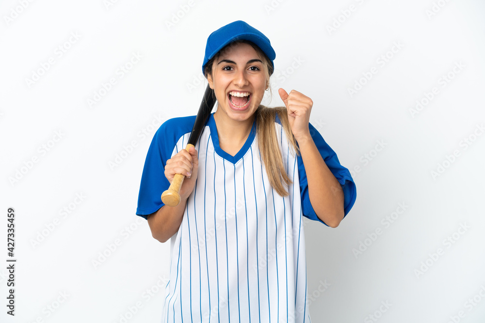Young caucasian woman playing baseball isolated on white background celebrating a victory in winner position Young caucasian woman playing baseball isolated on white background celebrating a victory in winner position