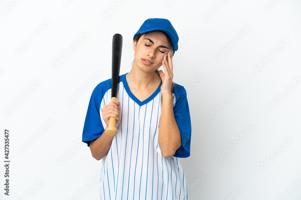 Young caucasian woman playing baseball isolated on white background with headache Young caucasian woman playing baseball isolated on white background with headache