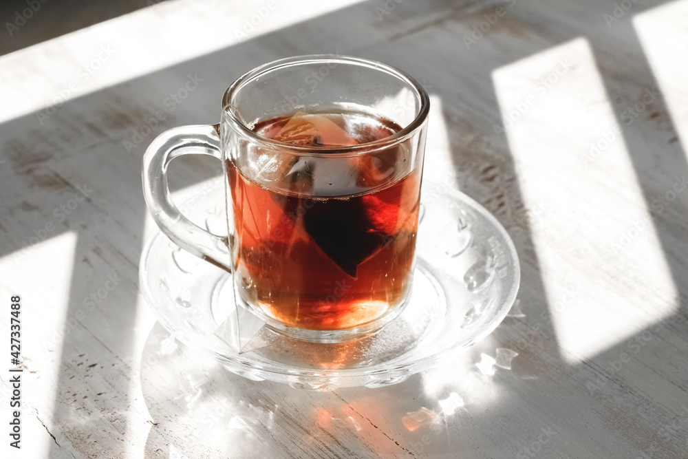 tea and jasmine on a wooden table tea and jasmine on a wooden table