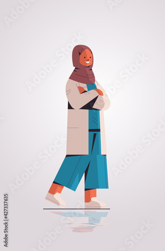 muslim woman doctor in uniform arabic female medical professional standing pose medicine healthcare