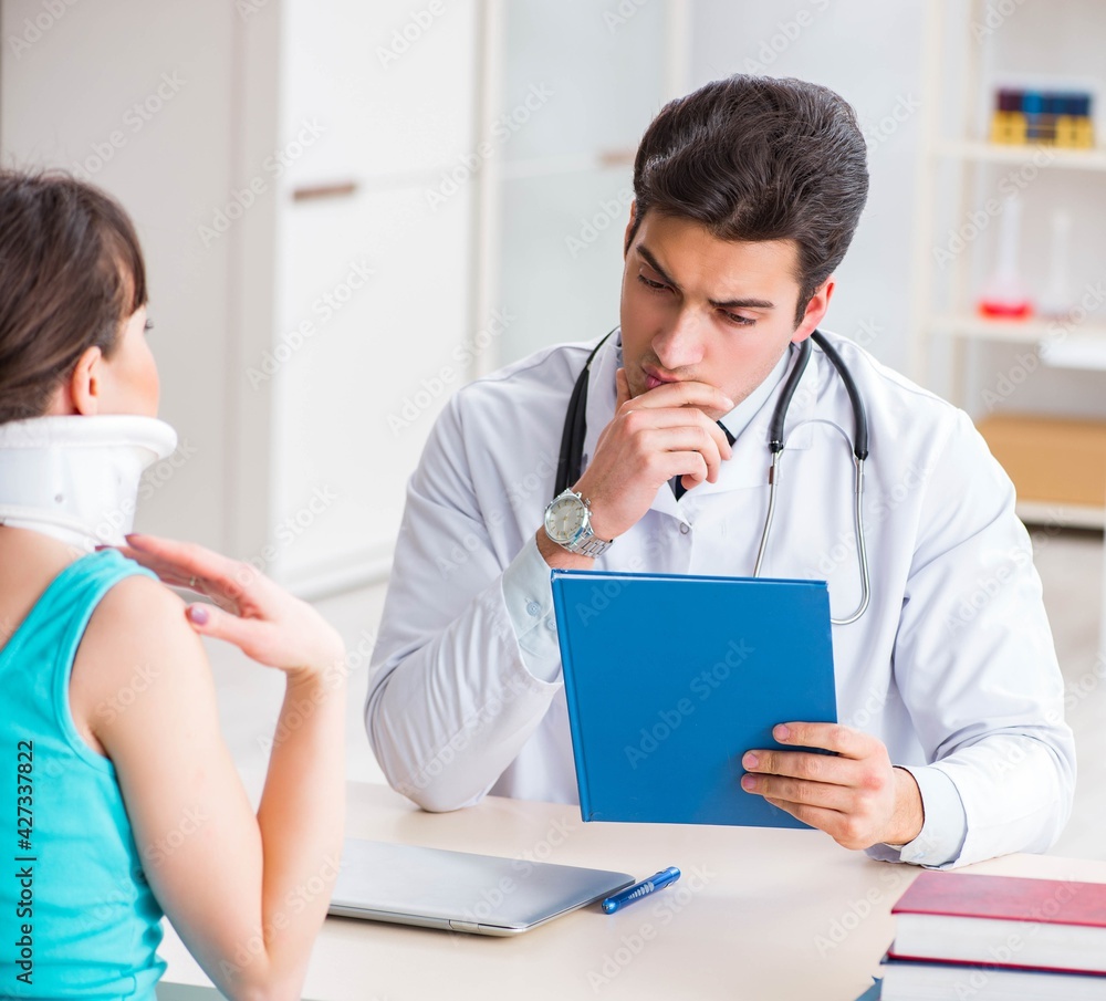 Doctor is explaining to patient with neck injury Doctor is explaining to patient with neck injury