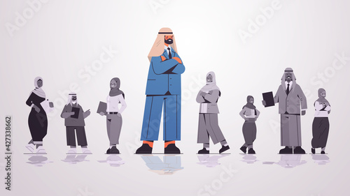 arab businessman leader standing in front of arabic businesspeople group leadership business competition