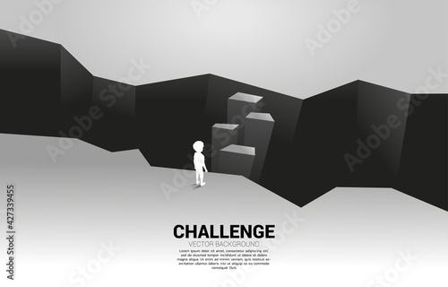 silhouette of kid standing on step forward to cross abyss. Concept of education solution and future of children.