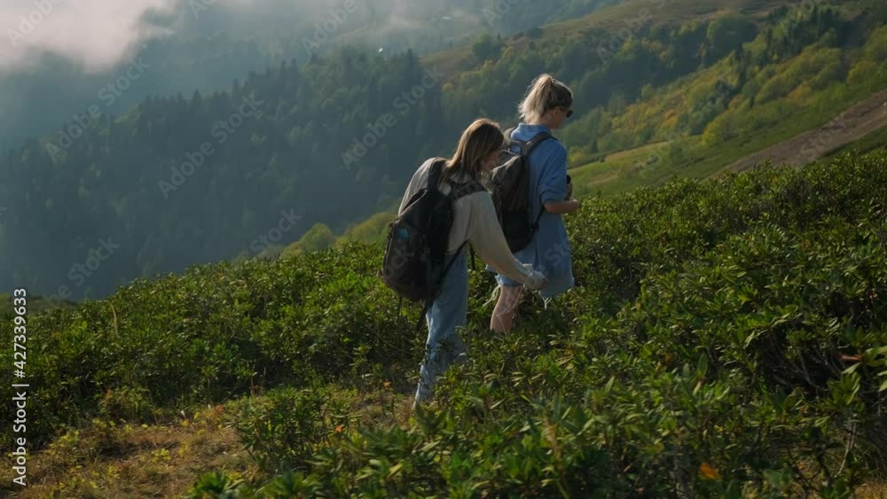 Girls backpackers in the highlands