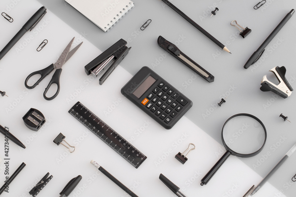Pattern composition of office and school stationery on white, grey background. Back to school Pattern composition of office and school stationery on white, grey background. Back to school