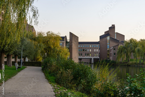 Outdoor scenery view on promenade riverside of Meuse river and Government of Limburg  during sunset time in Maastricht, Netherlands.   © Peeradontax