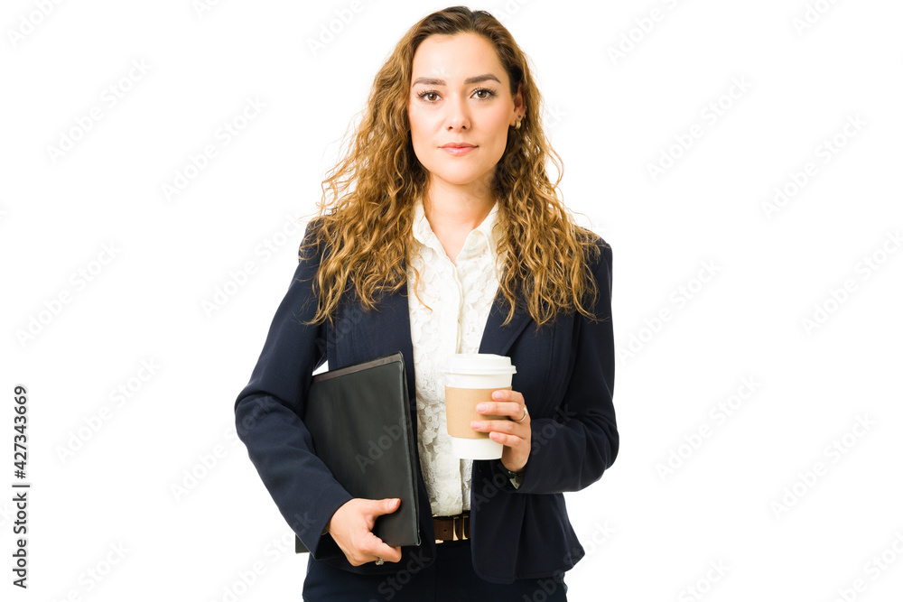 Serious business woman working and drinking coffee Serious business woman working and drinking coffee