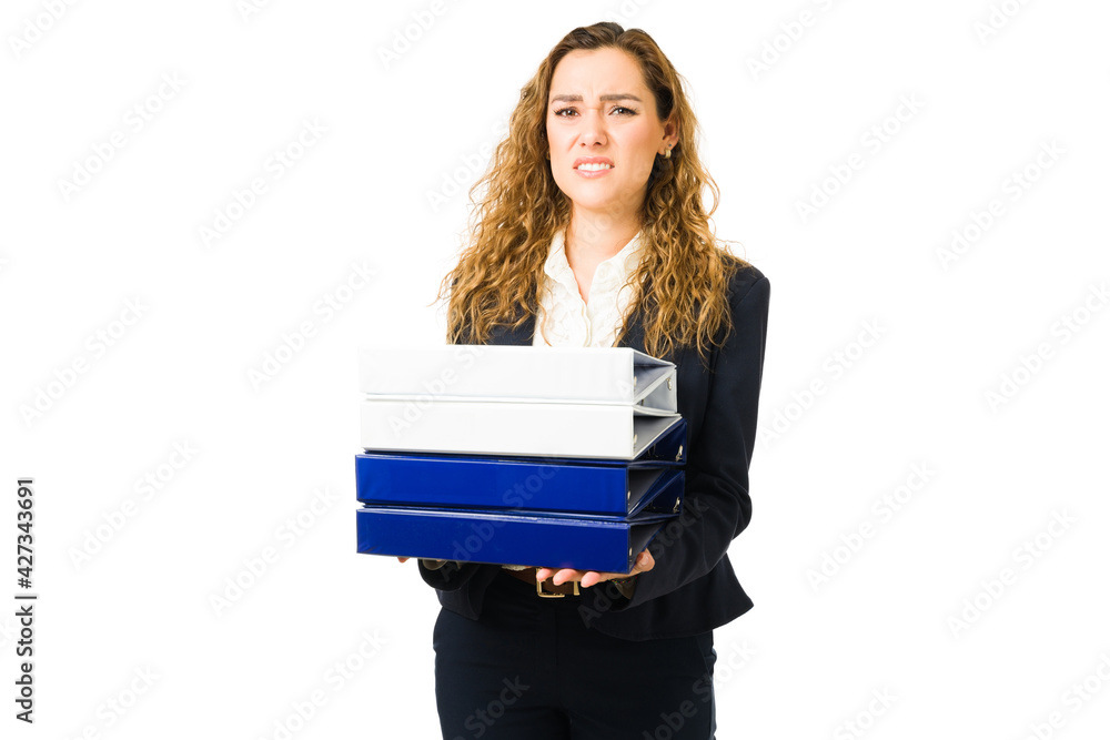 Latin young woman feeling annoyed while working Latin young woman feeling annoyed while working