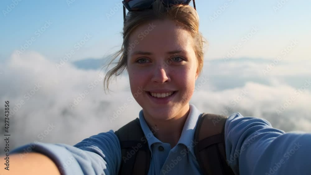 selfie shooting of woman tourist on top of mountain selfie shooting of woman tourist on top of mountain