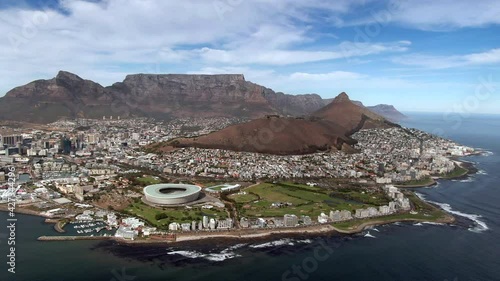 Aerial view Cape Town cityscape showing natural landmarks Table Mountain and Lions Head on a sunny day, Western Cape, South Africa.