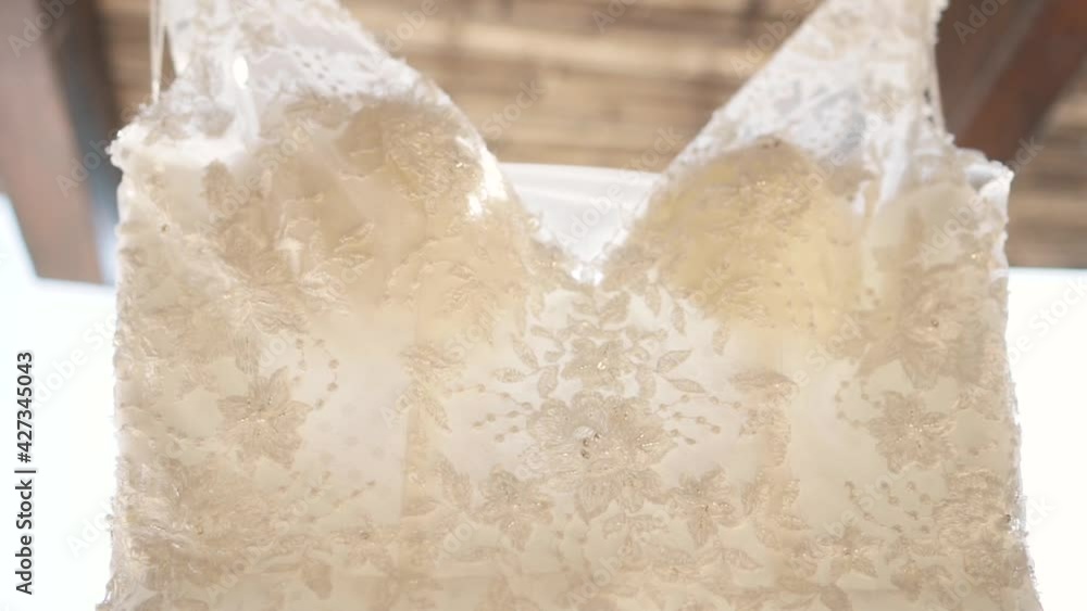 Close up of elegant and beautiful wedding dress. Handheld circling Close up of elegant and beautiful wedding dress. Handheld circling